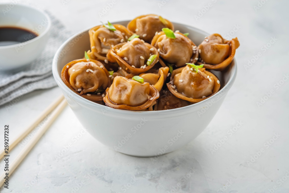 Fried dumplings with soy sauce with pepper and green onions. Asian cuisine. Copy space. Fried dumplings with soy sauce with pepper and green onions. Asian cuisine. Copy space.