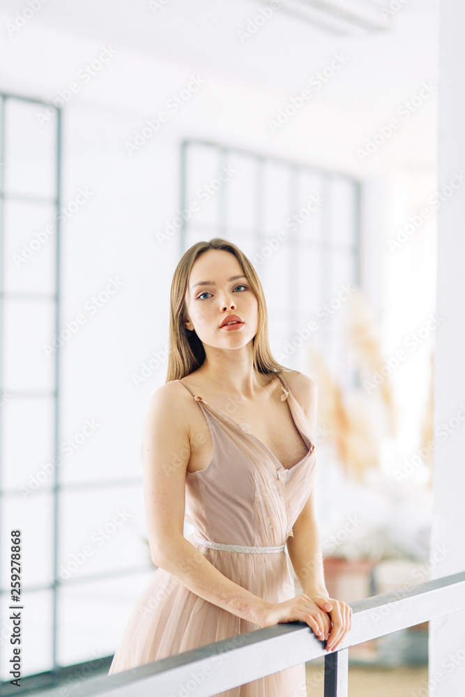 Modern fashionable bride in the loft interior. Minimalistic wedding in European style. Modern fashionable bride in the loft interior. Minimalistic wedding in European style.