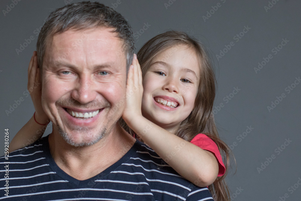 the daughter arranged a surprise for her father, covering his ears the daughter arranged a surprise for her father, covering his ears