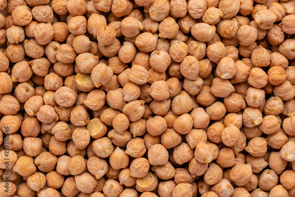 Chickpea in a white saucer on a gray concrete background Chickpea in a white saucer on a gray concrete background