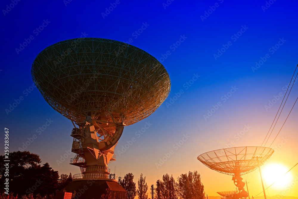 The silhouette of a radio telescope observatory The silhouette of a radio telescope observatory