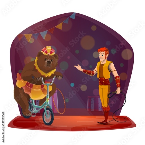 Animal trainer, bear riding bicycle. Circus show