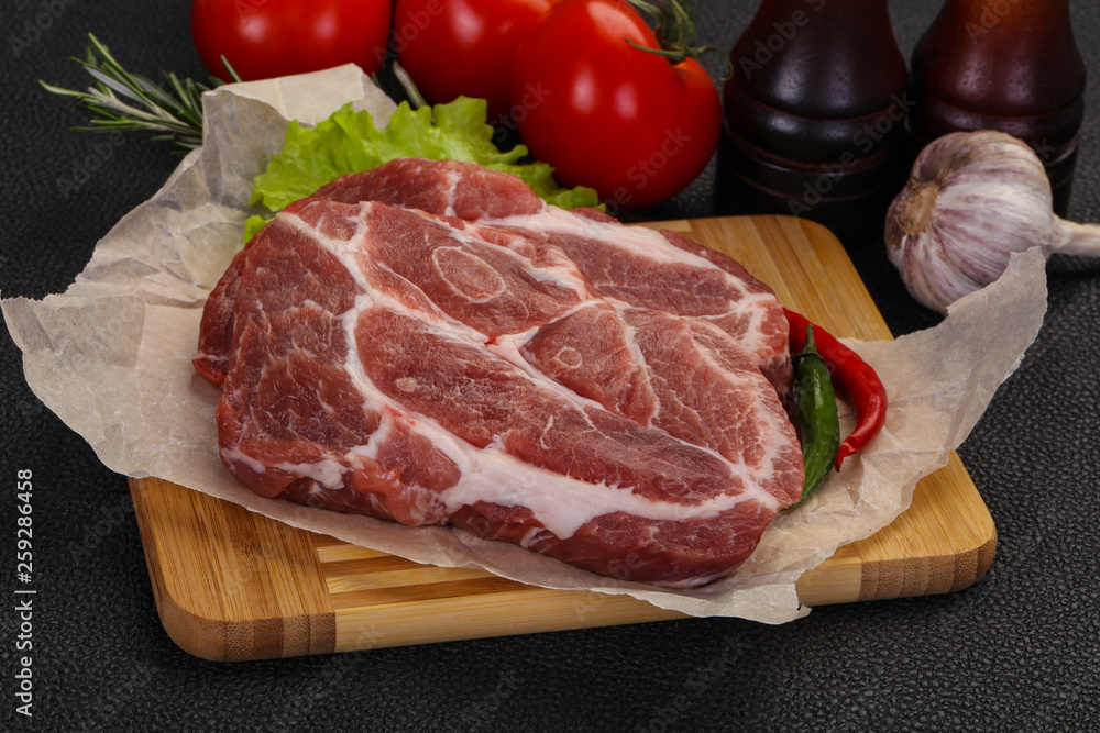 Raw pork neck steak