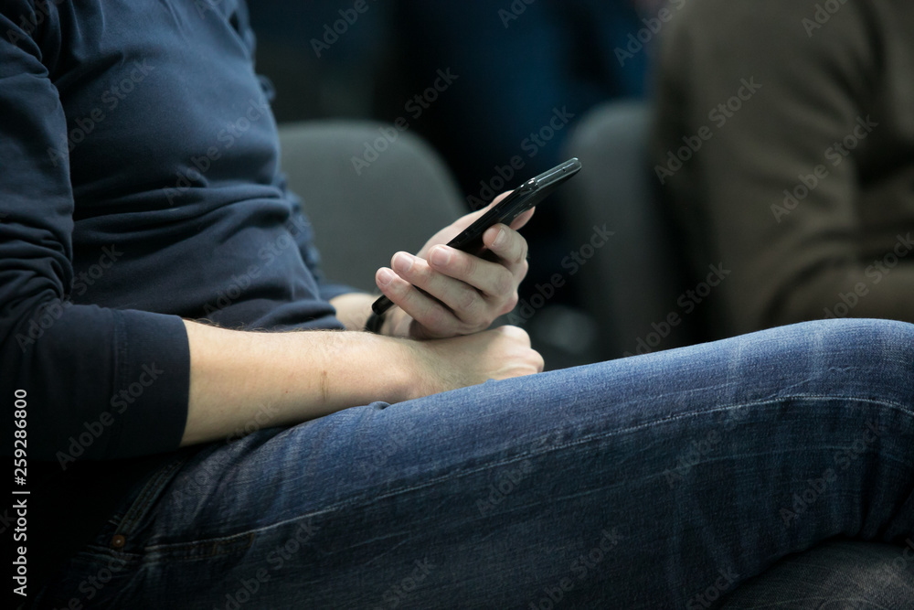man, student, businessman sitting with a phone