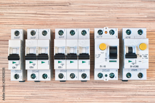 Modular electric circuit breakers, RCD and differential automatic. Residual current device and differential switch with test buttons. Modern and reliable product line. Compact version. photo