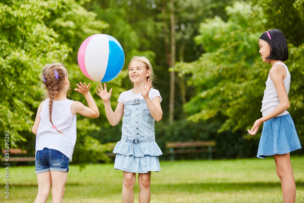 Three girls playing with ball Stock Photo | Adobe Stock