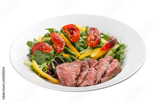 Salad with roast beef and sun-dried tomatoes on white background