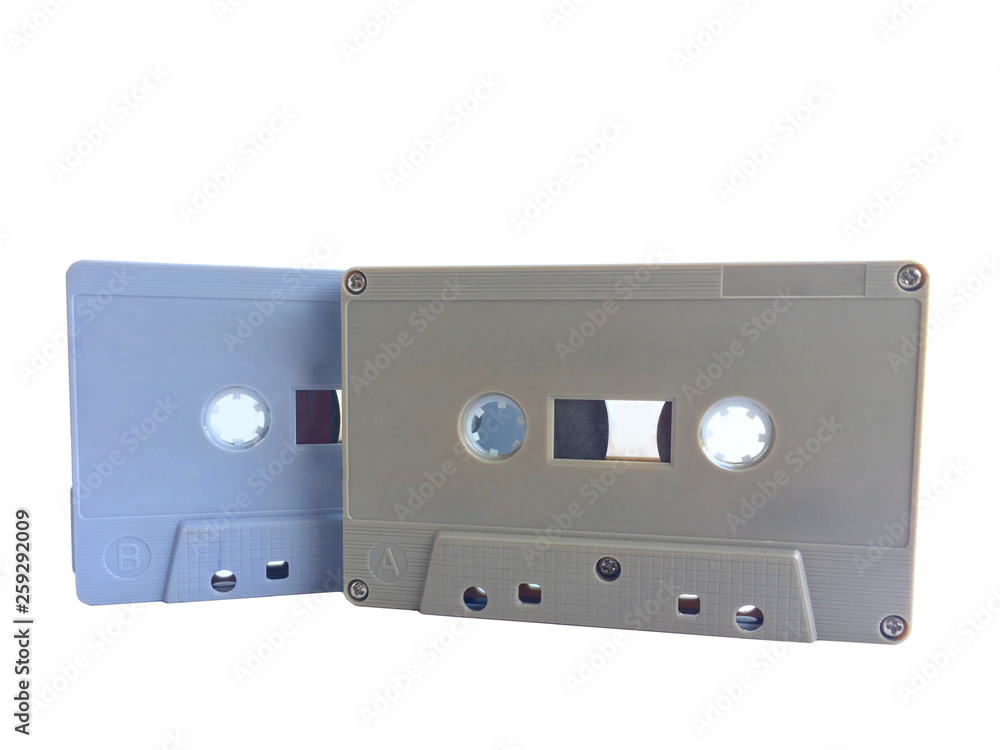 Old classic audio gray and brown tape cassette overlapping isolated on white background Old classic audio gray and brown tape cassette overlapping isolated on white background