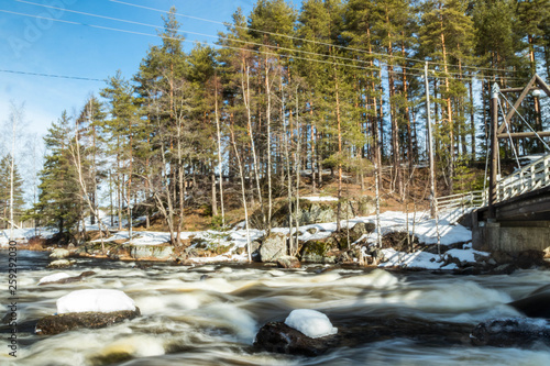 Long exposure photo. Dam and threshold on the river Jokelanjoki, Kouvola, Finland photo