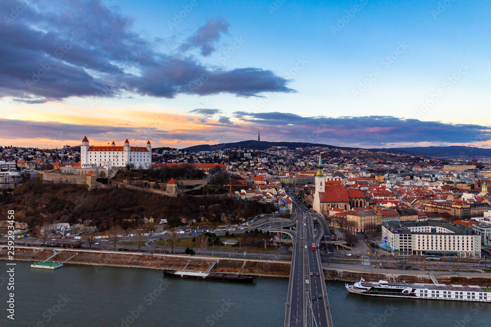 Bratislava, Slovakia: aerial panorama of the old city center at sunset across the Danube river