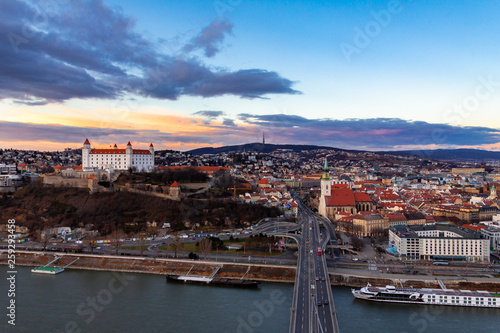 Bratislava, Slovakia: aerial panorama of the old city center at sunset across the Danube river