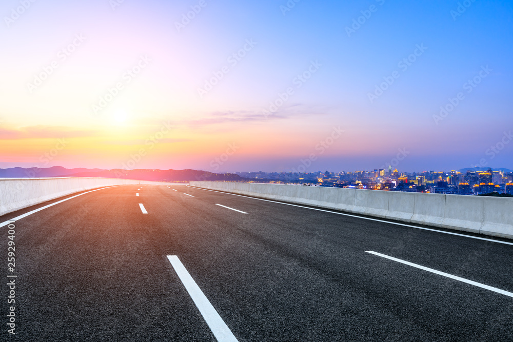 Naklejka premium Asphalt highway passing through the city above in Hangzhou at sunset