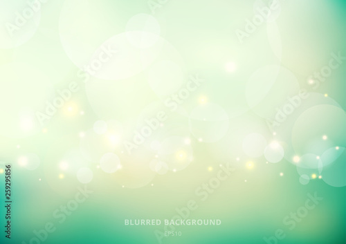 Abstract nature glowing sun light flare and bokeh with green turquoise color smooth blurred background.