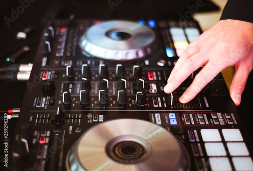 DJ plays and mix music on digital midi controller