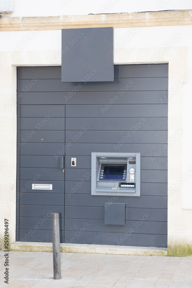 Modern street atm bank machine on grey background for withdrawal of money and other financial transactions Modern street atm bank machine on grey background for withdrawal of money and other financial transactions