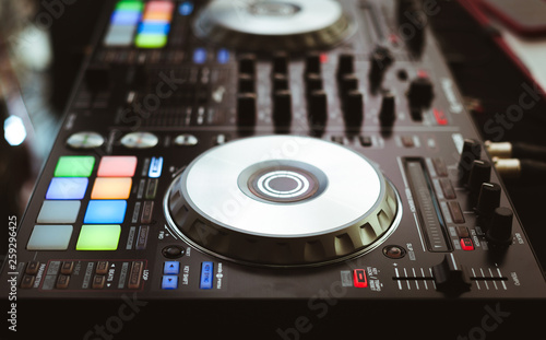 DJ plays and mix music on digital midi controller
