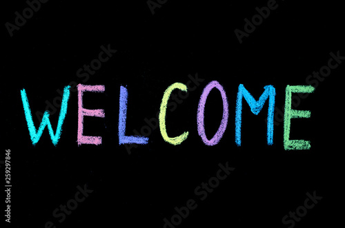 sign welcome on chalkboard