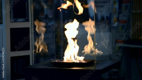 Contemporary mount biofuel on ethanol fireplot fireplace close-up. photo