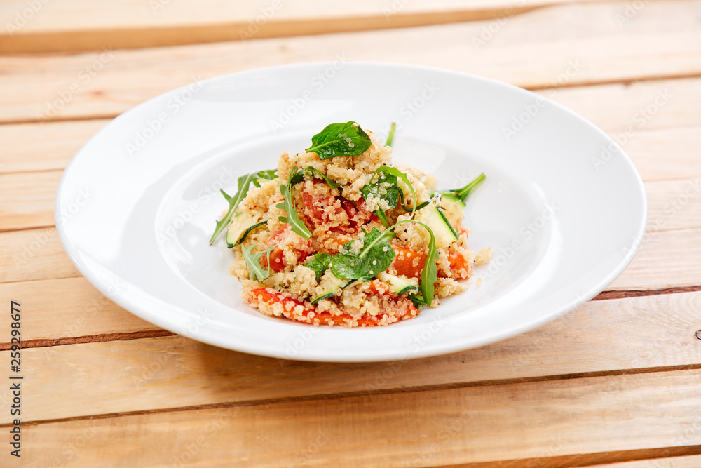 An easy, zesty summer salad with a Mediterranean flair featuring Israeli couscous and chopped summer vegetables An easy, zesty summer salad with a Mediterranean flair featuring Israeli couscous and chopped summer vegetables
