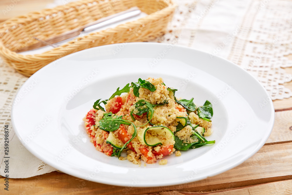An easy, zesty summer salad with a Mediterranean flair featuring Israeli couscous and chopped summer vegetables An easy, zesty summer salad with a Mediterranean flair featuring Israeli couscous and chopped summer vegetables