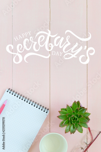 Open notebook with pink pen, coffee cup and succulent. Hand written lettering Happy Secretary's day