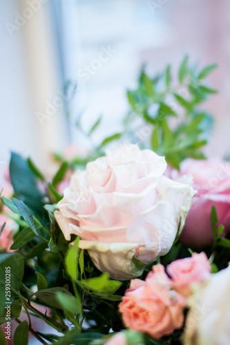 delicate bouquet of pink and beige peony and spray roses