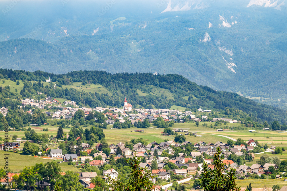 Countryside landscape in Slovenia. Panoramic view of a village in the mountains. Travel Slovenia.