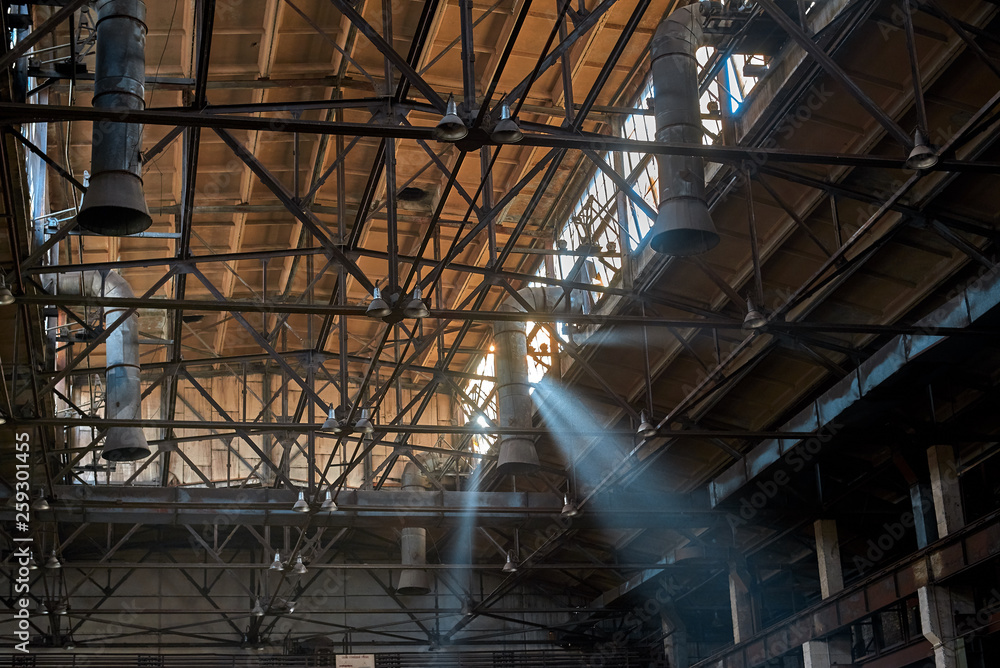 ceiling of old abandoned factories with windows and hoods