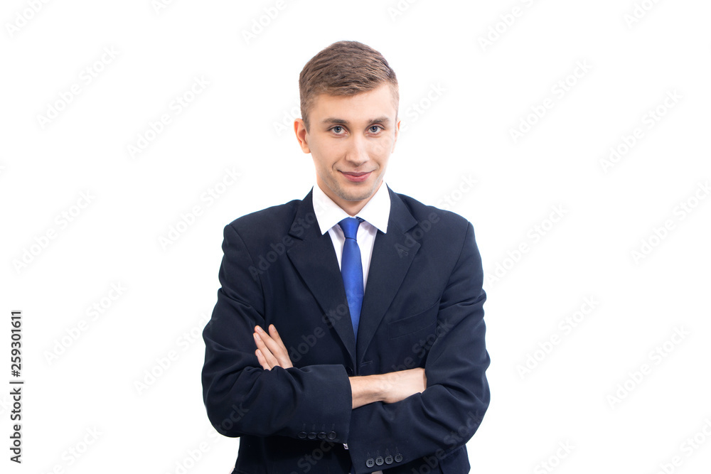 young attractive serious business man straightens bright blue tie, isolated on white young attractive serious business man straightens bright blue tie, isolated on white