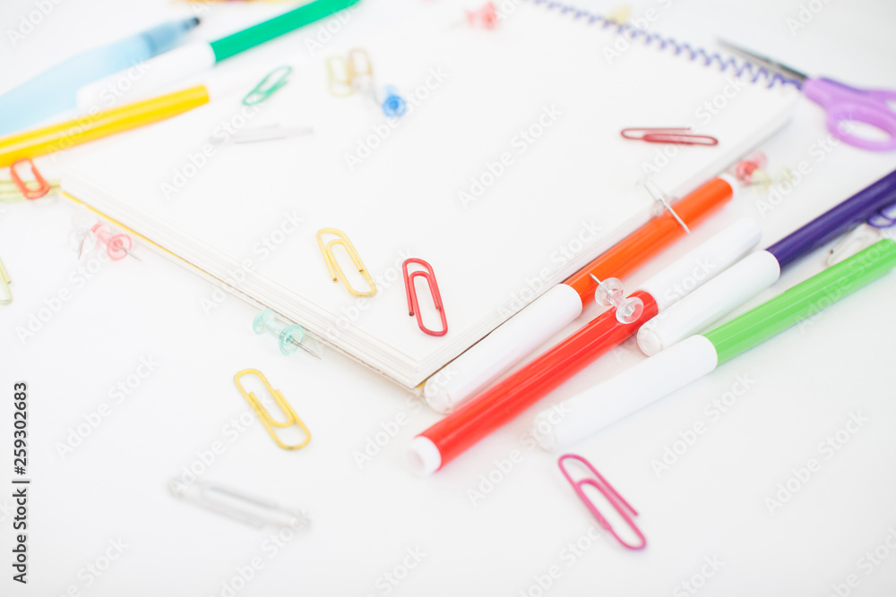 Bright stationery for study: paper, felt-tip pens, scissors, paper clips Bright stationery for study: paper, felt-tip pens, scissors, paper clips