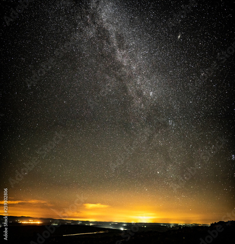 Milky way over country area with small villages