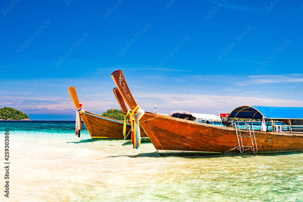 Long tail boat on tropical beach, Andaman Sea Thailand