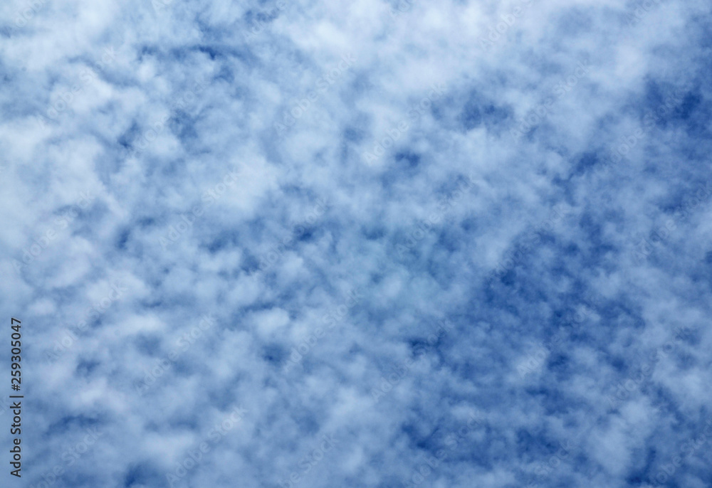 Blue sky natural background with white clouds.Abstract cloudy texture. Beautiful cloudscape. 