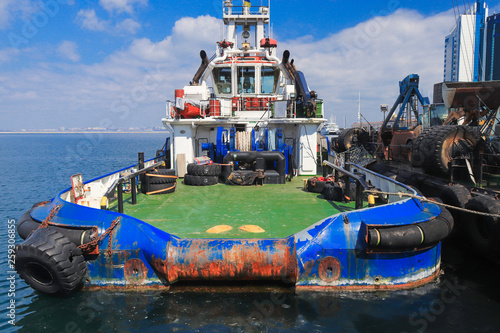 OSV boat, offshore supply vessel stand moored in harbor of Odessa, Ukraine photo