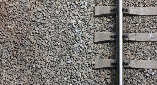 Fragment of the old railway track close-up. View from above. Background freight transport.