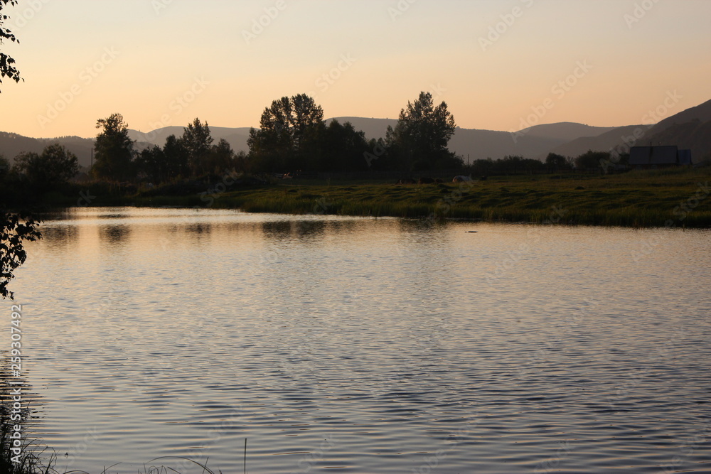 Naklejka premium sunset on the river