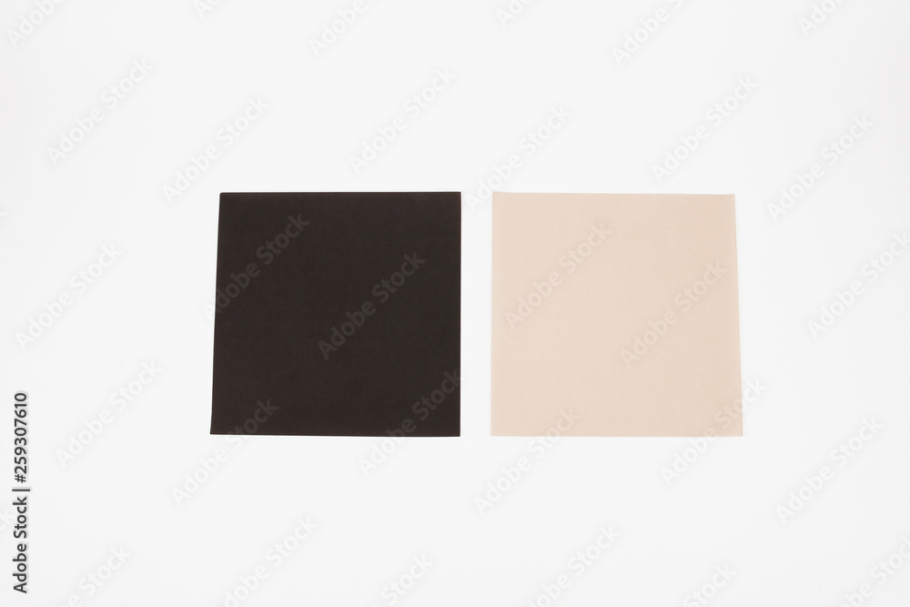 A blank black and bisque color paper isolated on white background. A blank black and bisque color paper isolated on white background.