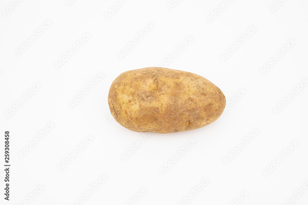 A raw russet potato isolated on white background A raw russet potato isolated on white background