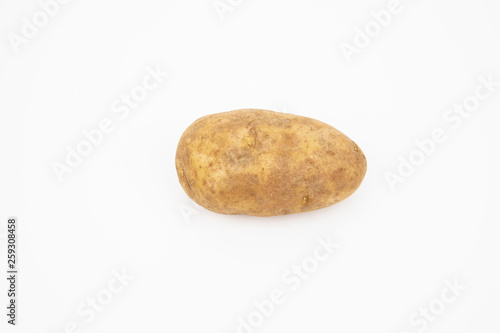 A raw russet potato isolated on white background