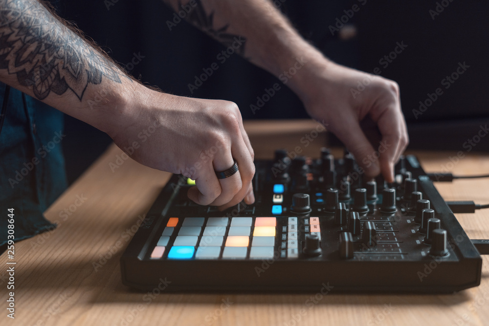 Dj man creates electronic music in the studio Dj man creates electronic music in the studio