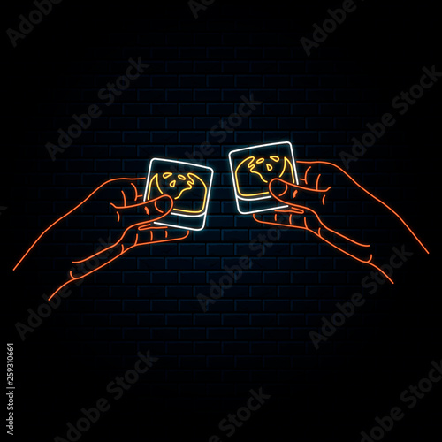 Glowing neon sign with two hands clinking scotch whiskey glasses. Vector isolated illustration. Icon for night bar background. Led luminous sign for pub signboard.