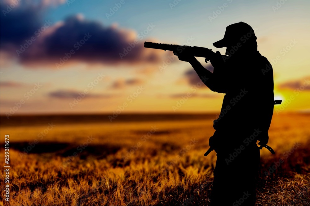 Male Hunter with Rifle on natural background