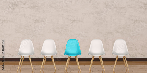 Chairs in modern design arranged in front of the gradient grey wall for interior or graphic backgrounds.