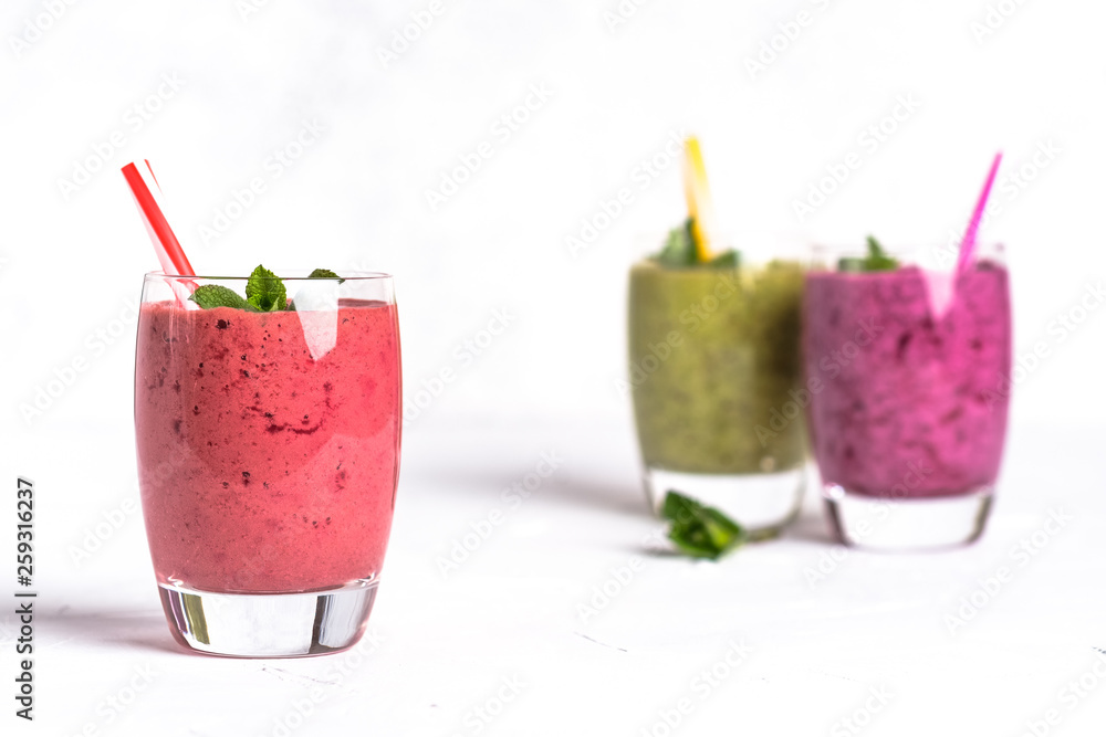 Fruit and berry smoothie blend at home on a light background Fruit and berry smoothie blend at home on a light background