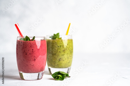 Fruit and berry smoothie blend at home on a light background copy space.