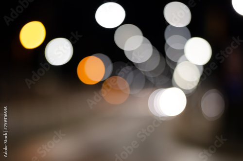 Defocused image of street  illuminated lights at night. © SnowMan