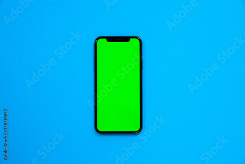 iPhone XS, smartphone, green screen on Blue background