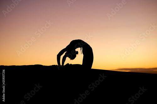 Fantastic moves from a yoga instructor make for fantastic silhouettes © jacojvr