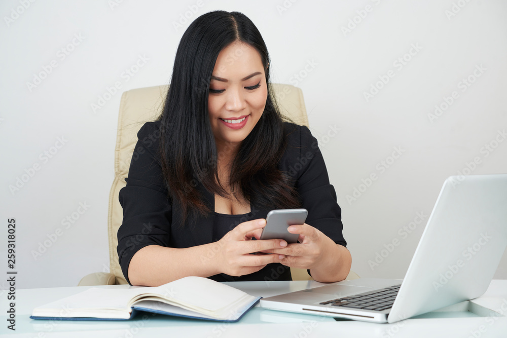 Businesswoman using smartphone Businesswoman using smartphone