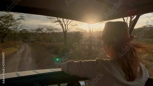 Woman on a safari trip in Masai Mara park, Kenya